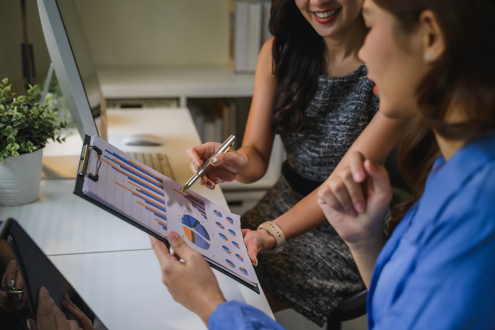 Payroll Business Women Analyzing Data Discussing Chart R 2025 10 08 13 06 53 Utc